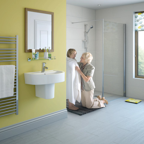 Bright and modern walk-in shower in a Winchester residence, featuring clear glass doors.
