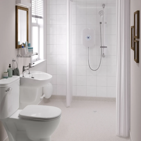 Spacious shower with a frameless glass partition for a minimalist look.